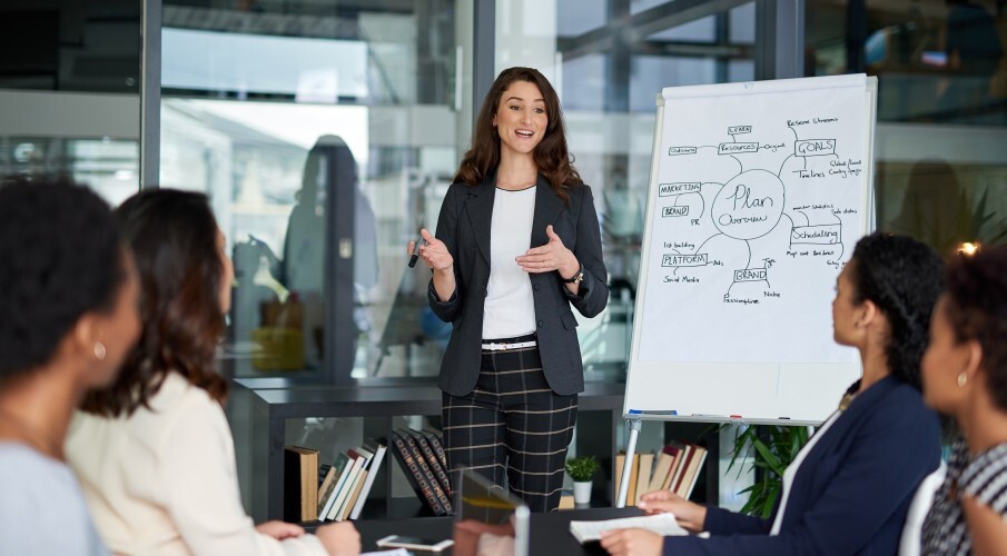 A group of professionals have a communication strategy planning meeting.