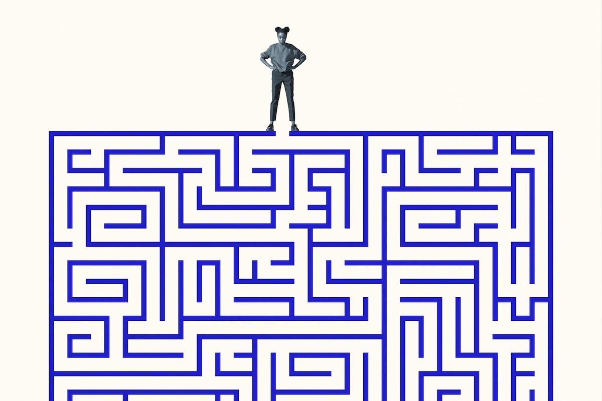 Full-length graphic design of a young woman standing with hands on her hips over blue maze against a solid background.